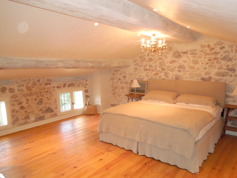 Exposed stone, beams and vaulted ceilings throughout